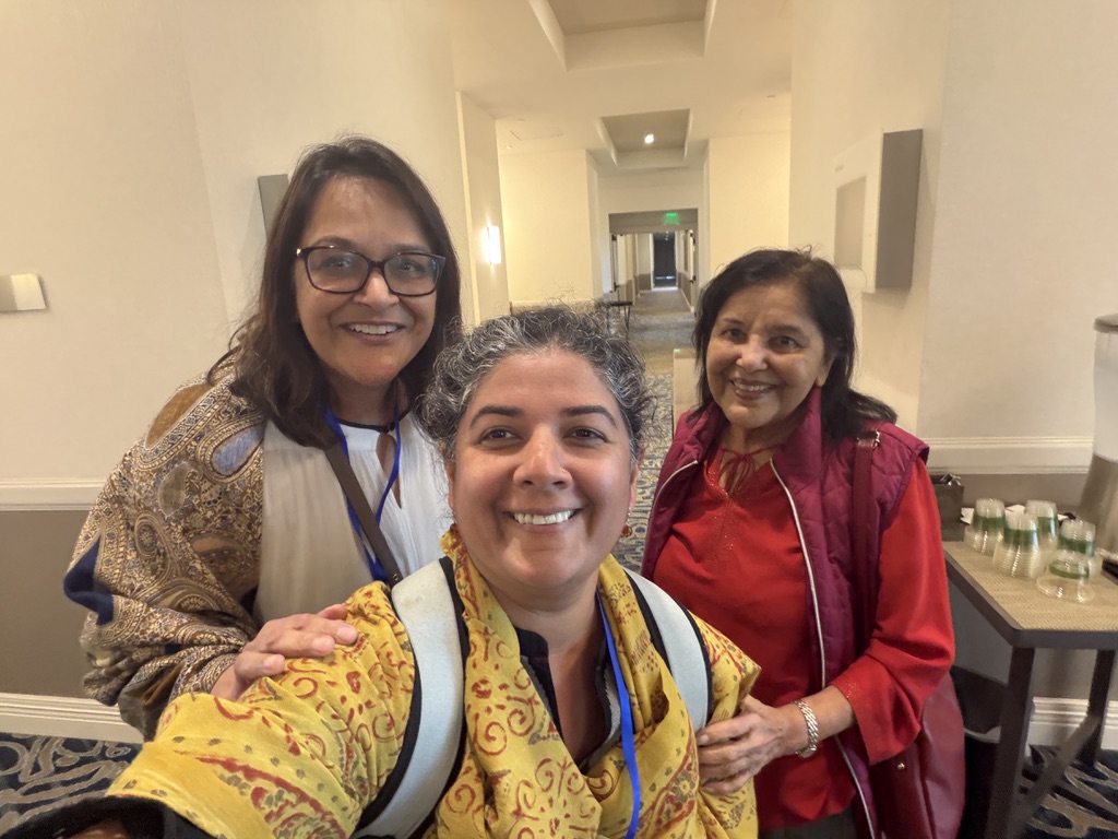 Nandini Deo with Rina Verma Williams and her mother in a hotel hallway